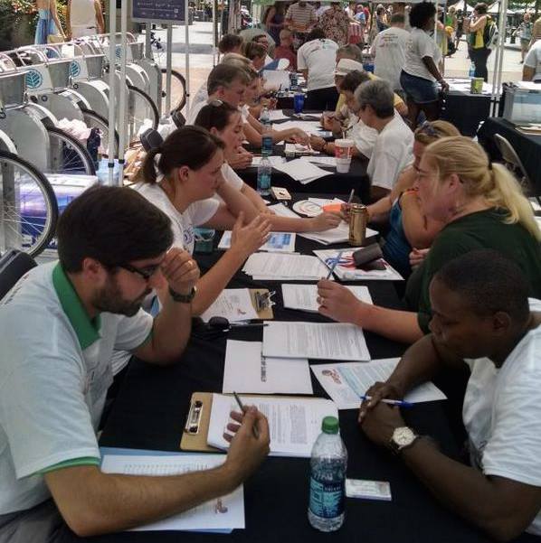 (Individuals complete Health Care Power of Attorney documents at Charlotte Pride.)